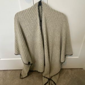 Like new oatmeal colored poncho with button and black stitching